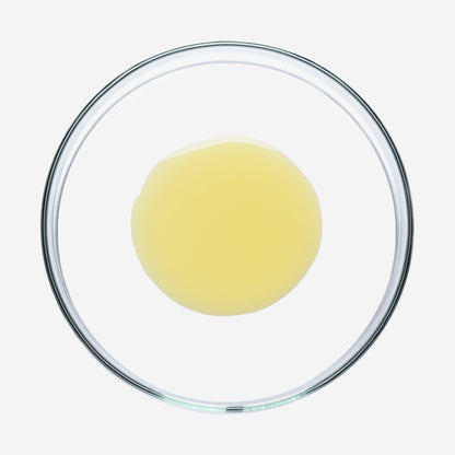 Gelbe Sun Shield Drops in einer Glasschale